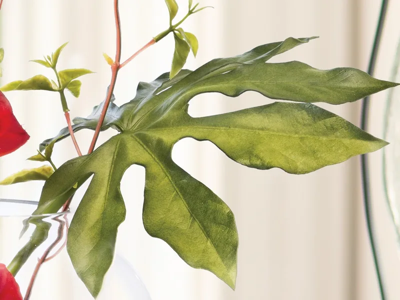 Silk monstera leaf with delicate leafy branches