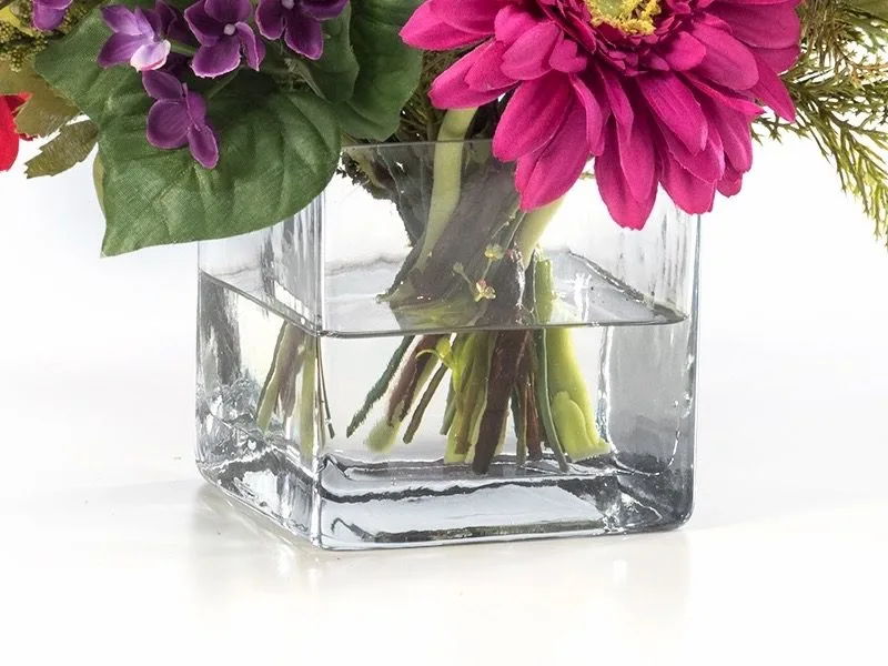 Glass cube vase filled with clear acrylic water around the stems