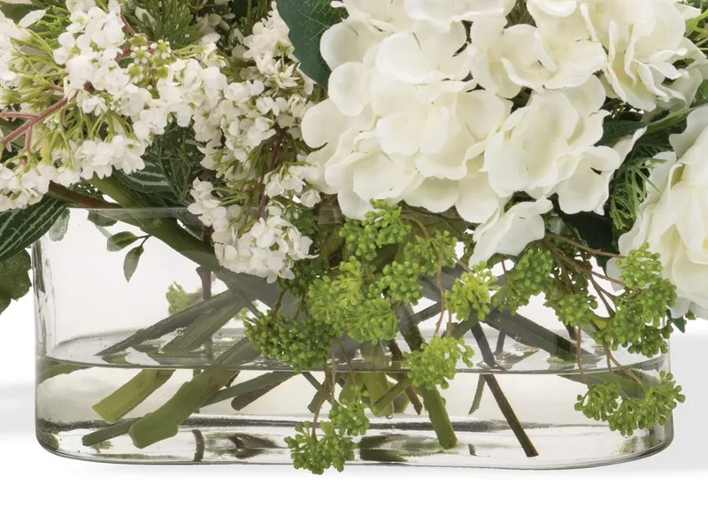 Oblong glass vase with clear acrylic water around crossed stems