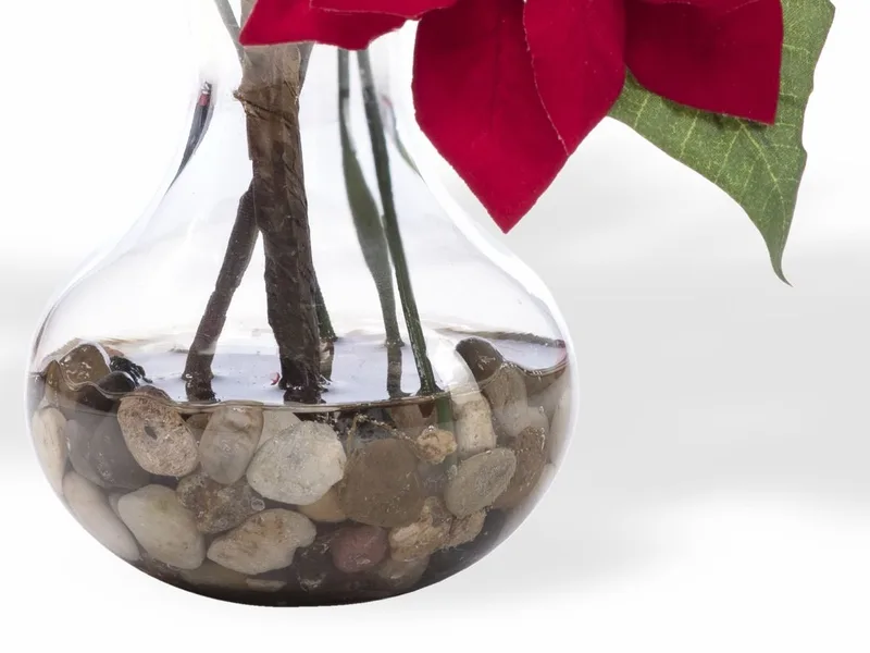 Sweetheart glass vase holding river stones and clear acrylic water