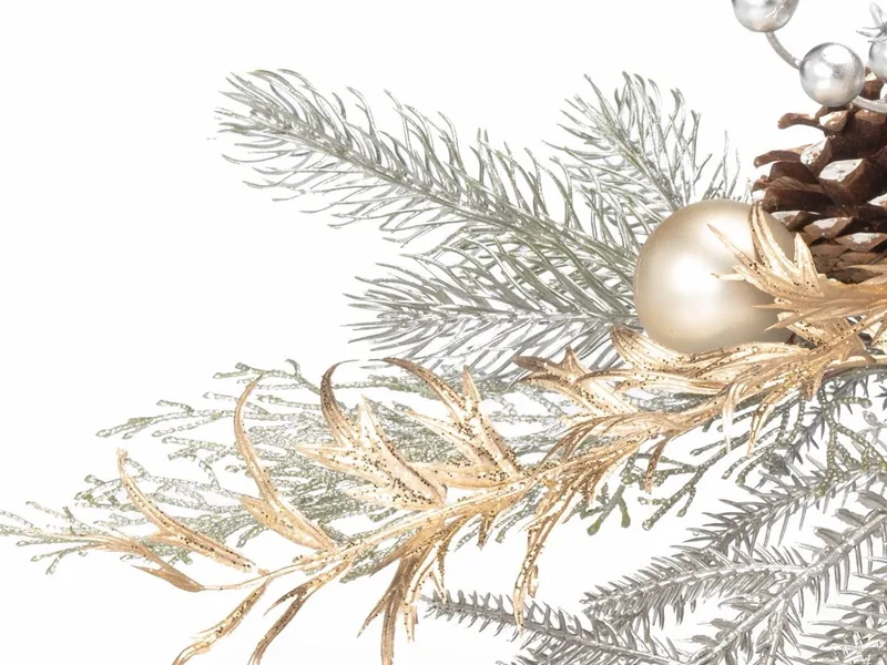 Close-up of frosted silk pine, cedar and spruce with gold brushed fronds