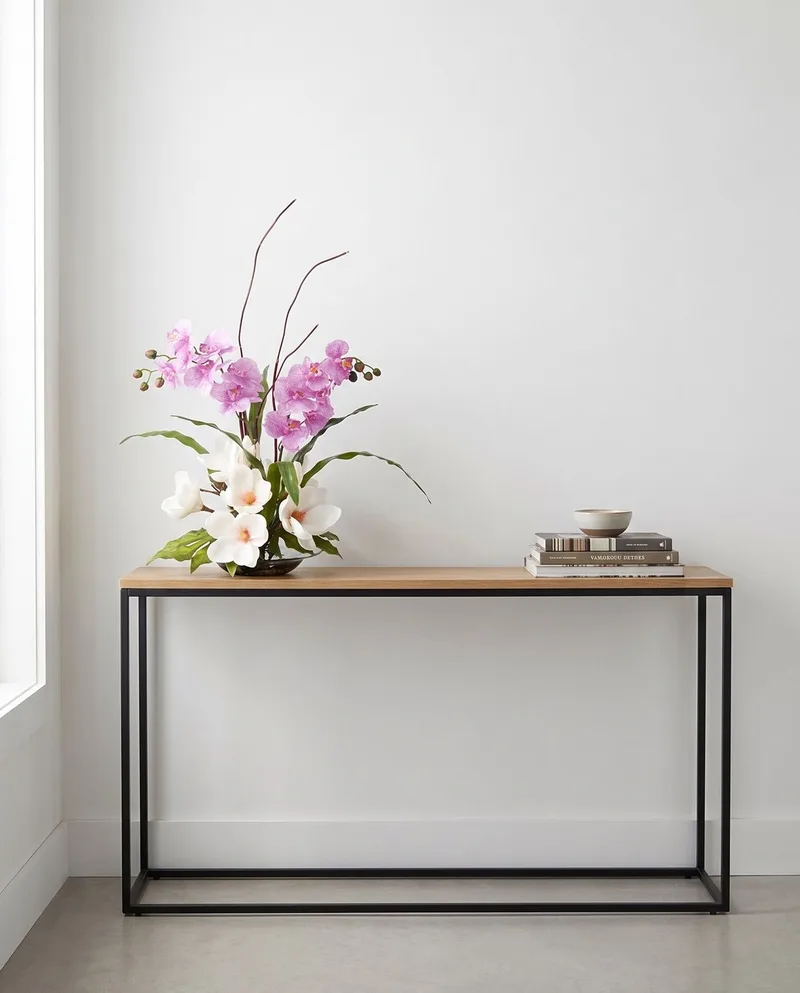 Magnolias and Orchids silk flower arrangement on an entry console