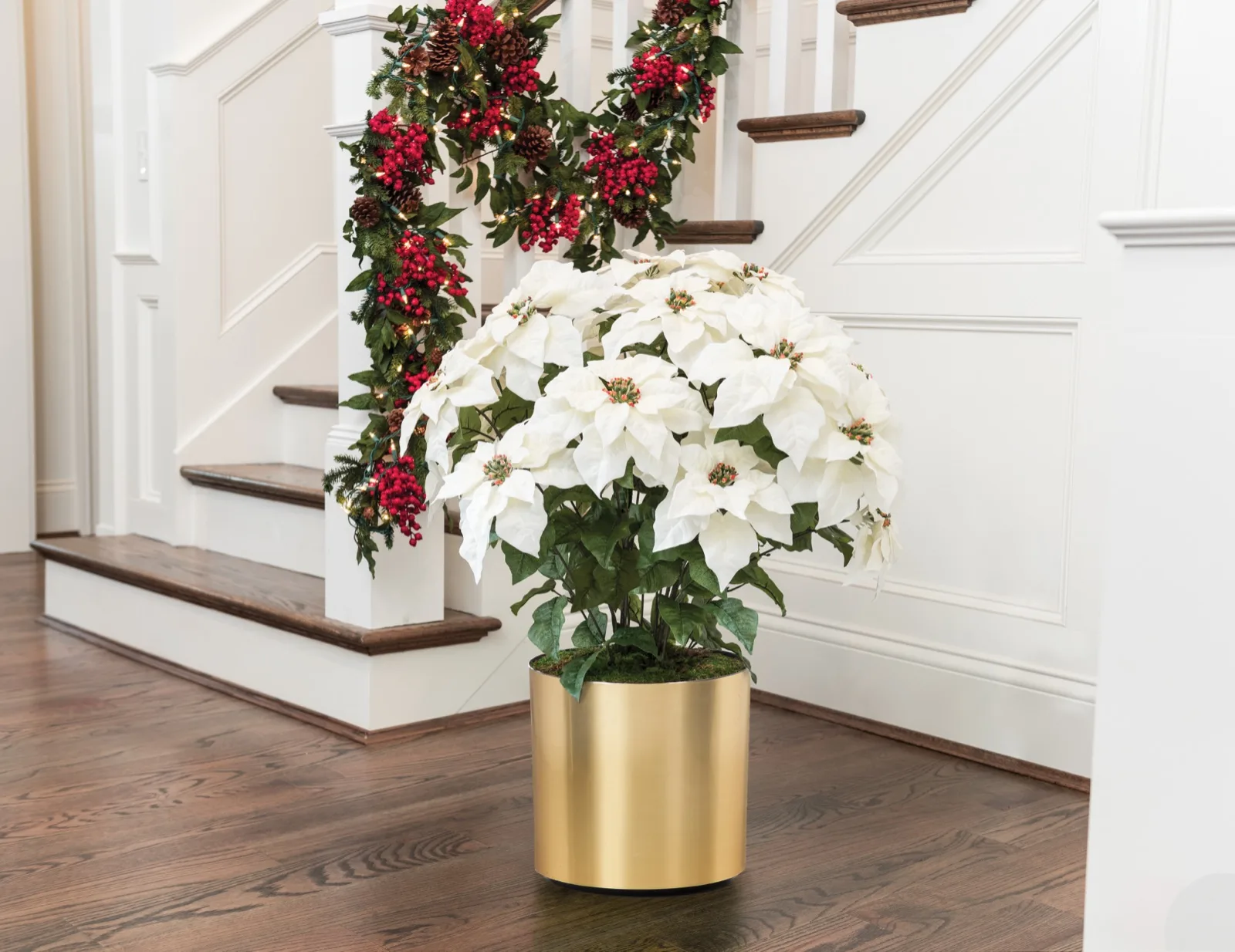 White Premier Silk Poinsettia in a holiday foyer