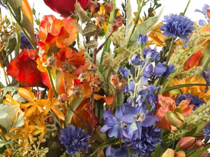 Close-up showing bold layered color across silk blooms