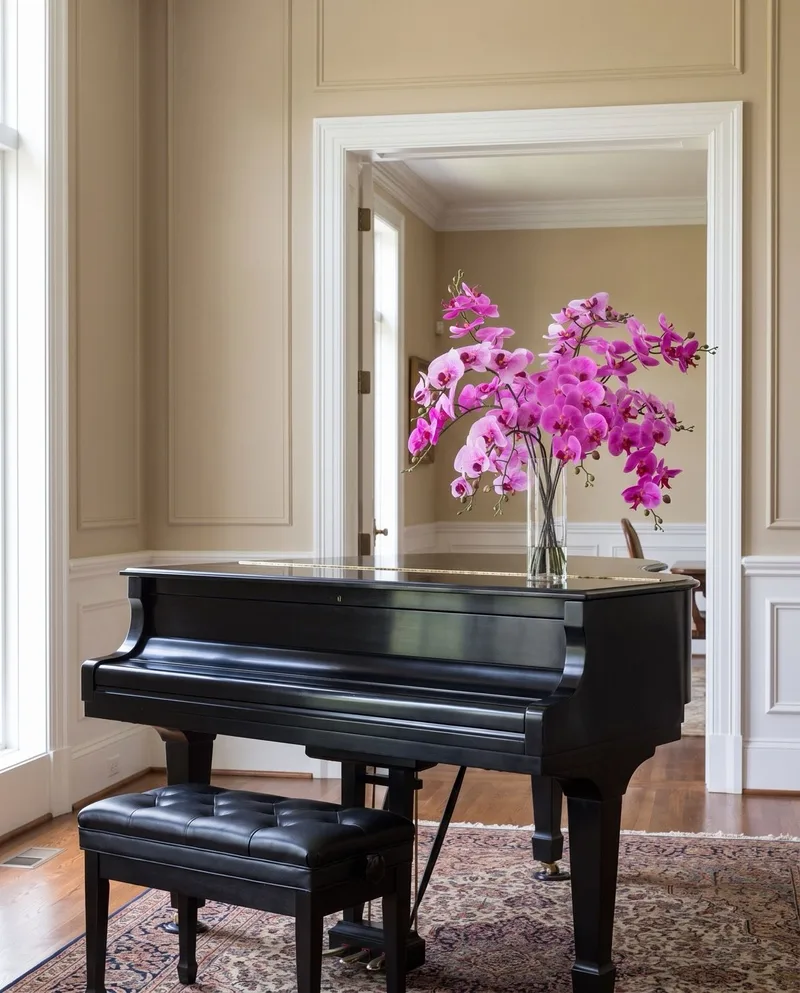 Grand Phalaenopsis silk orchid arrangement in Two Tone Fuchsia on a black grand piano