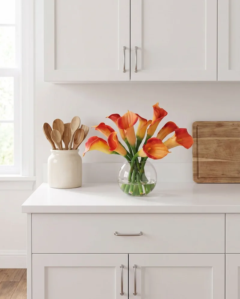 Calla Lily silk flower centerpiece in Orange on a kitchen counter