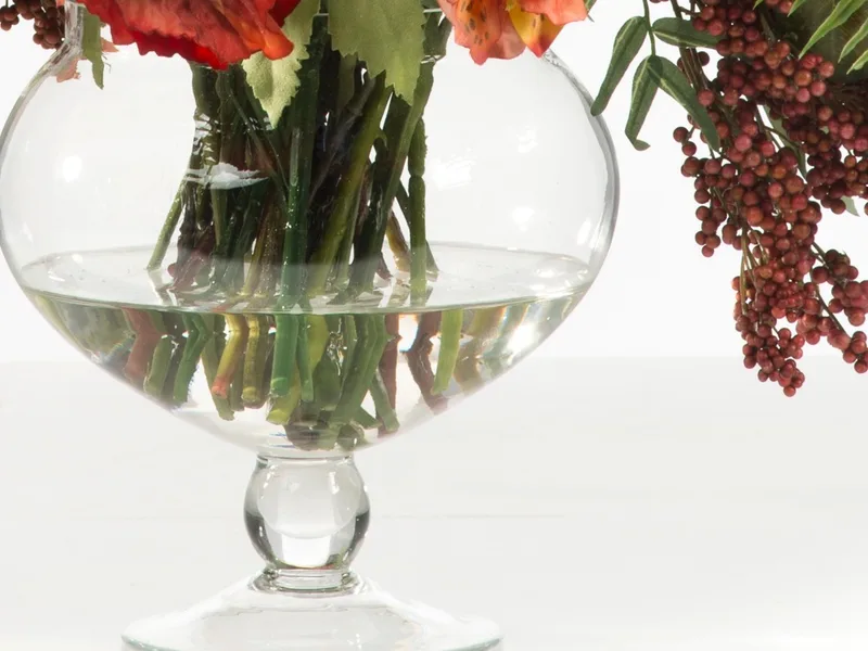 The 8-inch stemmed glass vase showing acrylic water and submerged stems