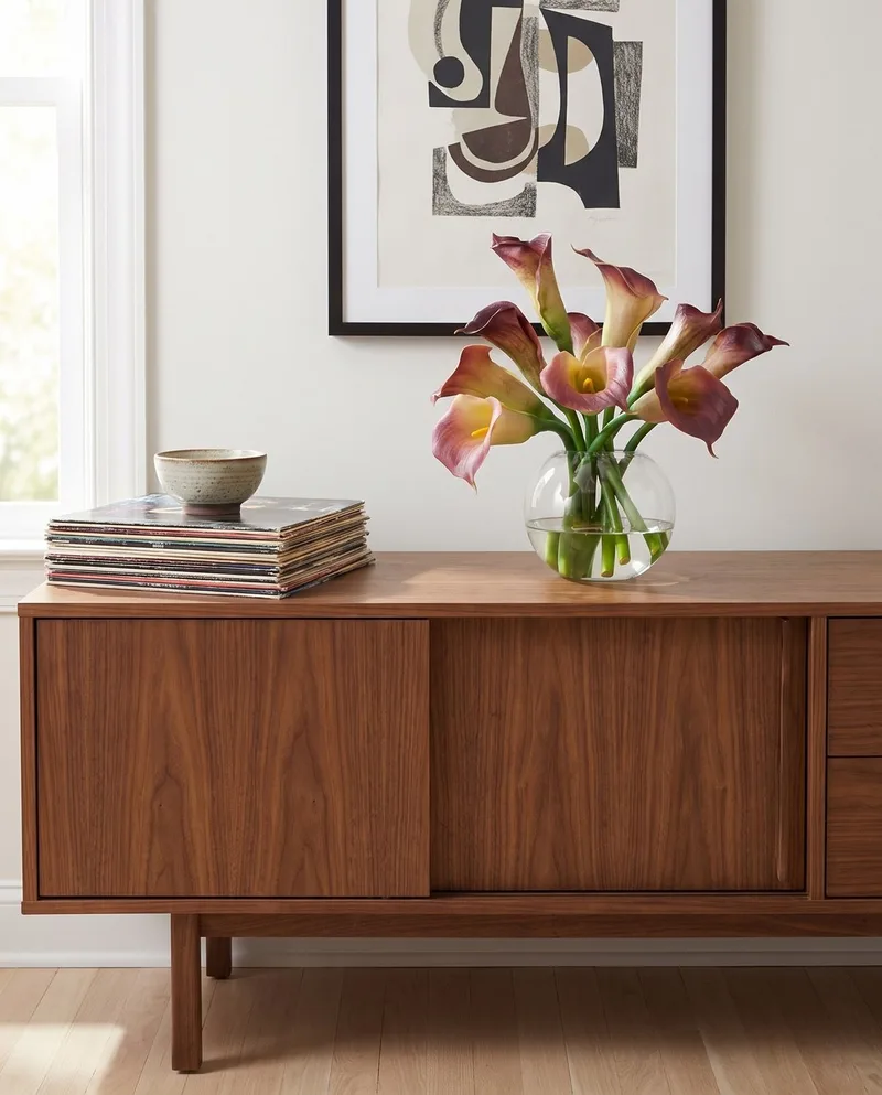 Calla Lily silk flower centerpiece in Eggplant on a sideboard