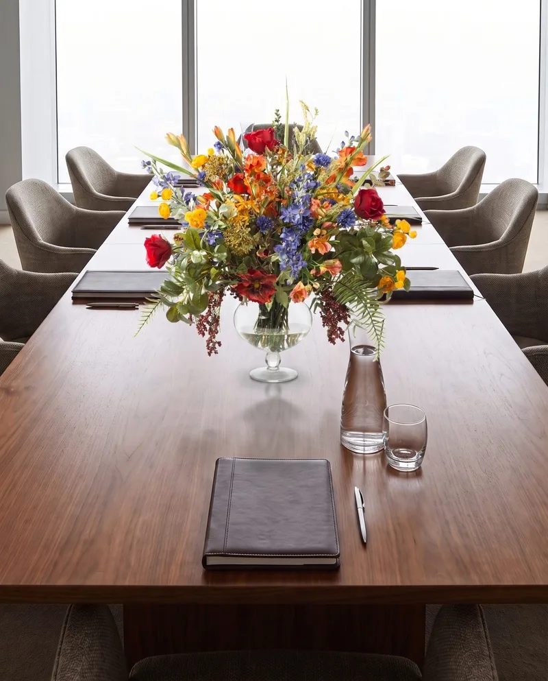 Glorious Garden centerpiece on a long walnut conference table