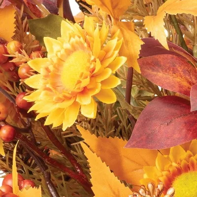Button mums in autumn tones — the floral anchor of the arrangement